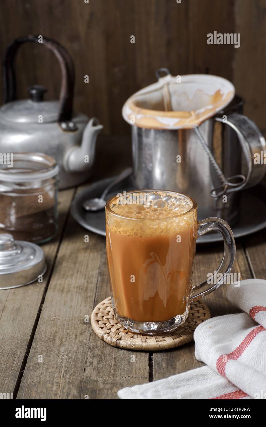Hot drink tea with milk Malay called Teh Tarik is a popular breakfast