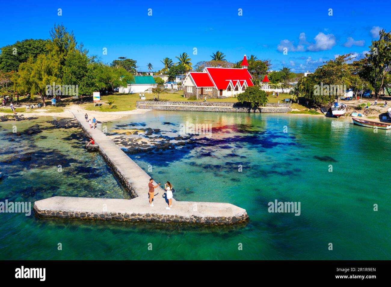 Aerial view of the traditional catholic red church near the beach in