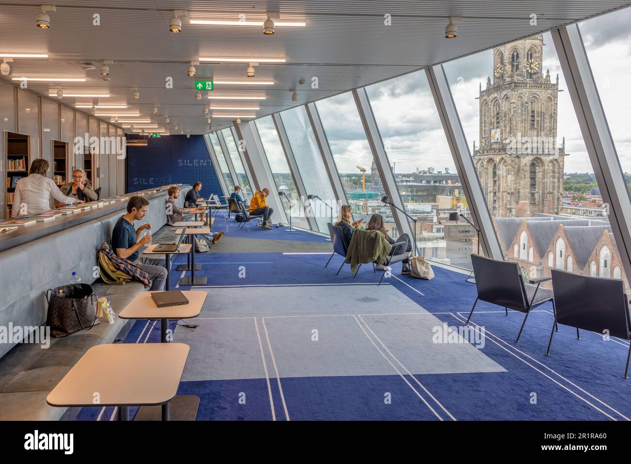 Groningen, The Netherlands - July 7, 2022: Interior modern Forum building medieval city Groningen with library and view at Martini Tower Stock Photo