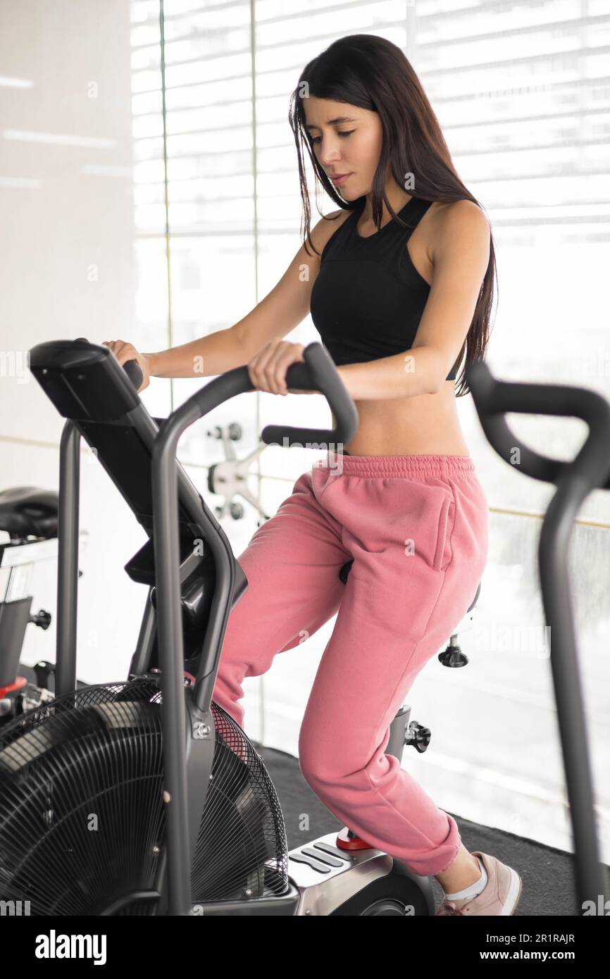 Lady with exercise equipment at home hi-res stock photography and