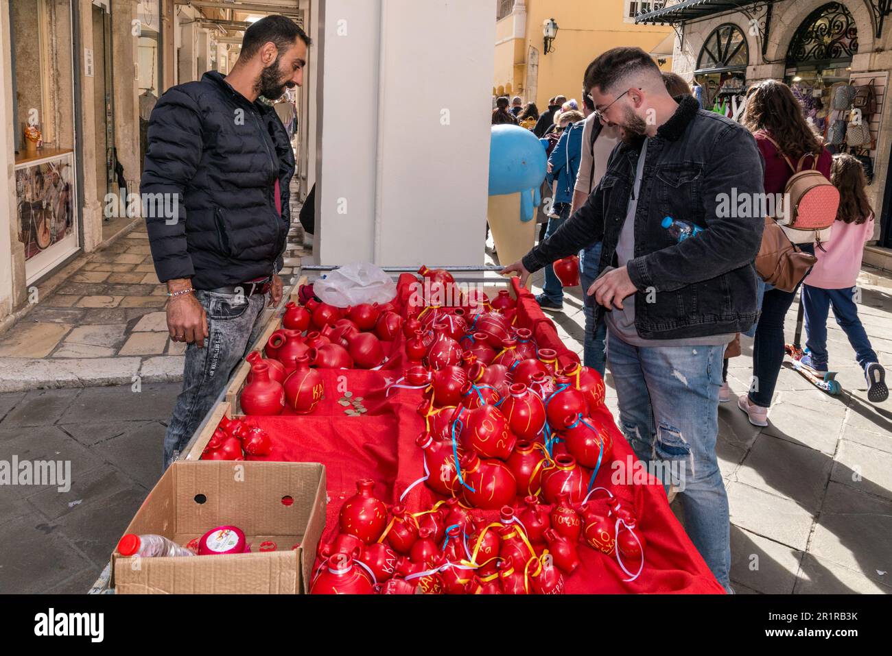 Street stand offering botides, red clay pots, to be broken, dropped from balconies and windows at 11 am on Holy Saturday, signalling Christ's resurrection, Nikiforou Theotoki street in Campiello (Old Town of Corfu) section, in town of Corfu, Corfu Island, Greece Stock Photo