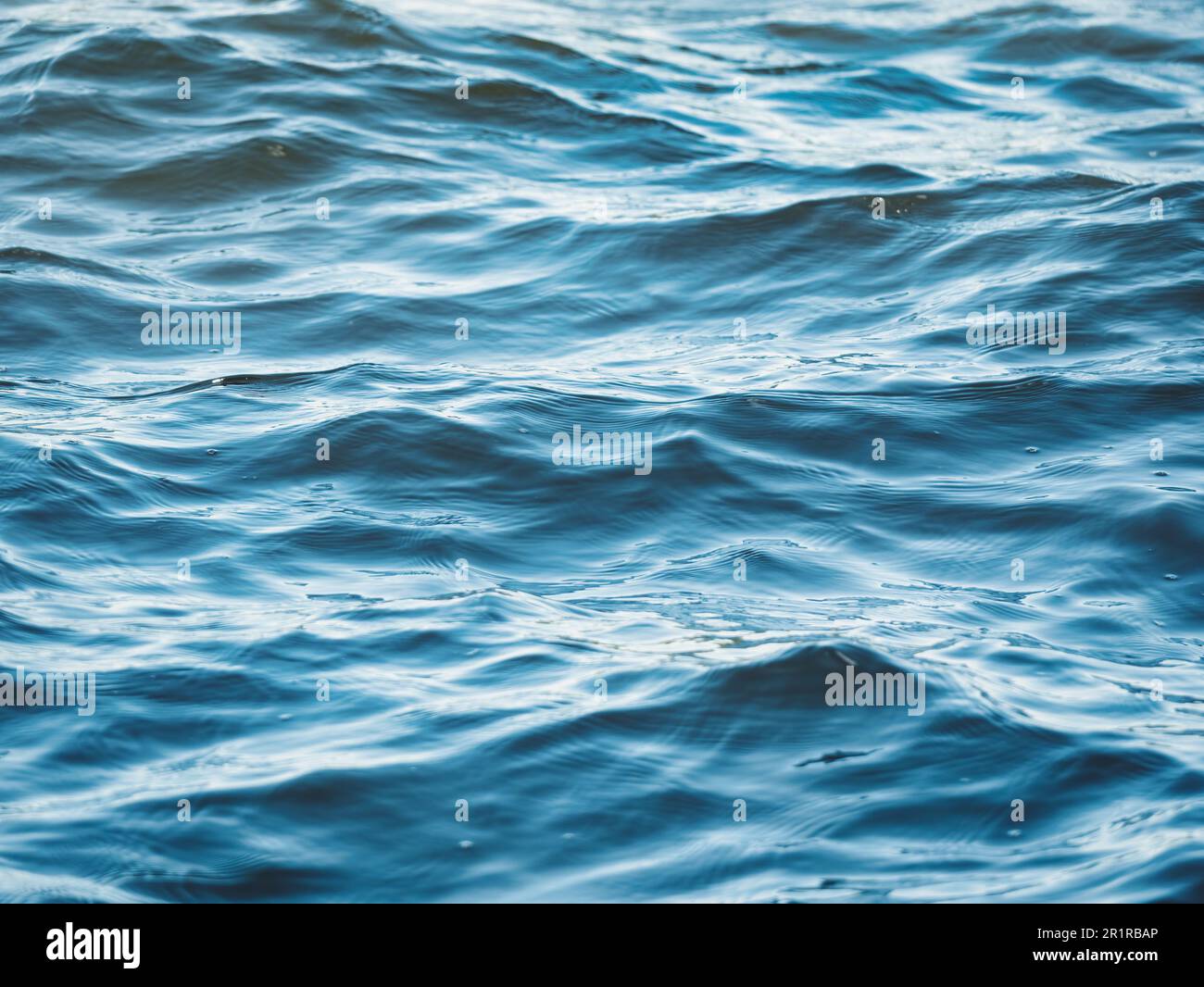 Blue sea water ripples texture background. Stock Photo