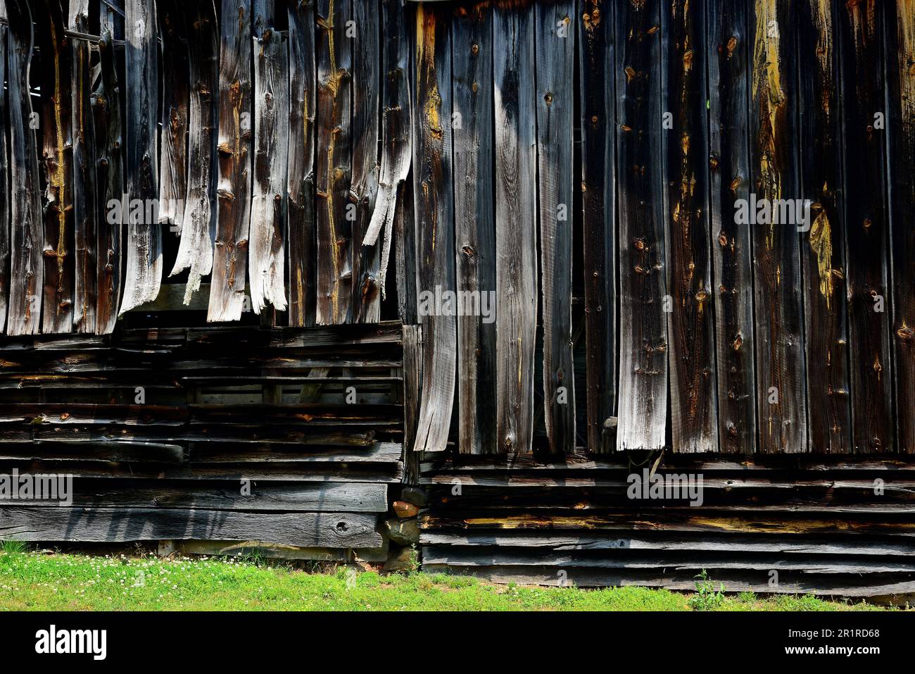 Weathered old barn with warped boards Stock Photo