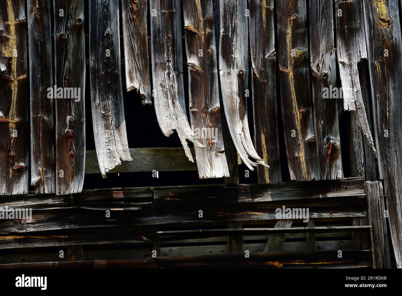 Weathered old barn with warped boards Stock Photo