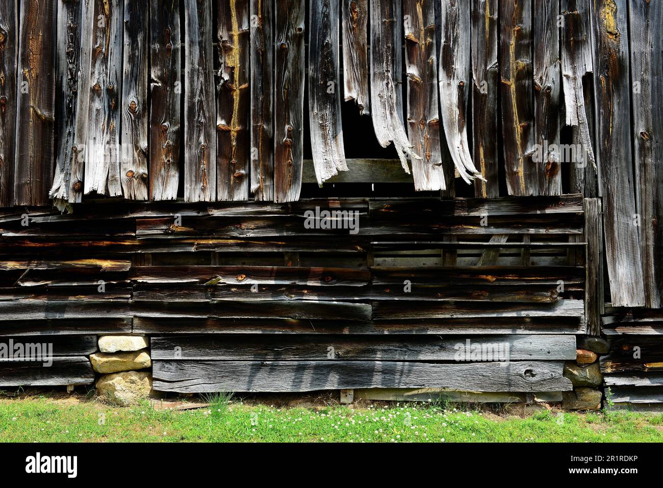 Weathered old barn with warped boards Stock Photo