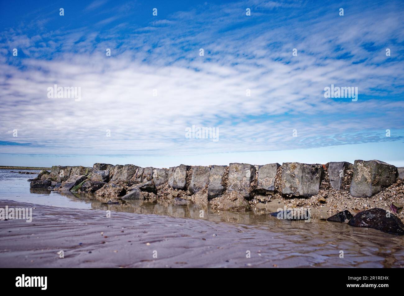 Stone wall on the beach, Baltrum, East Frisia, Lower Saxony, Germany Stock Photo