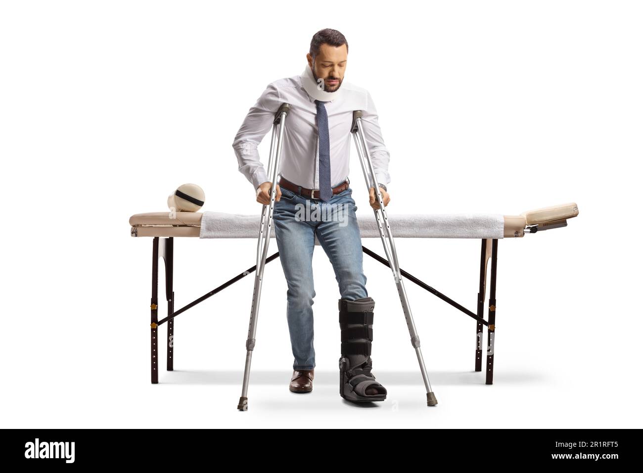 Full length portrait of a man with an orthopedic boot walking with