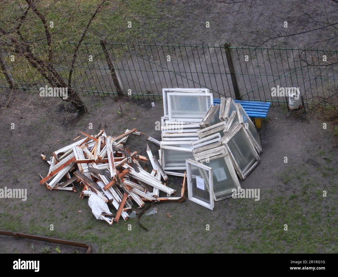 Construction debris from the dismantling of old windows in the courtyard of a the house. Stock Photo