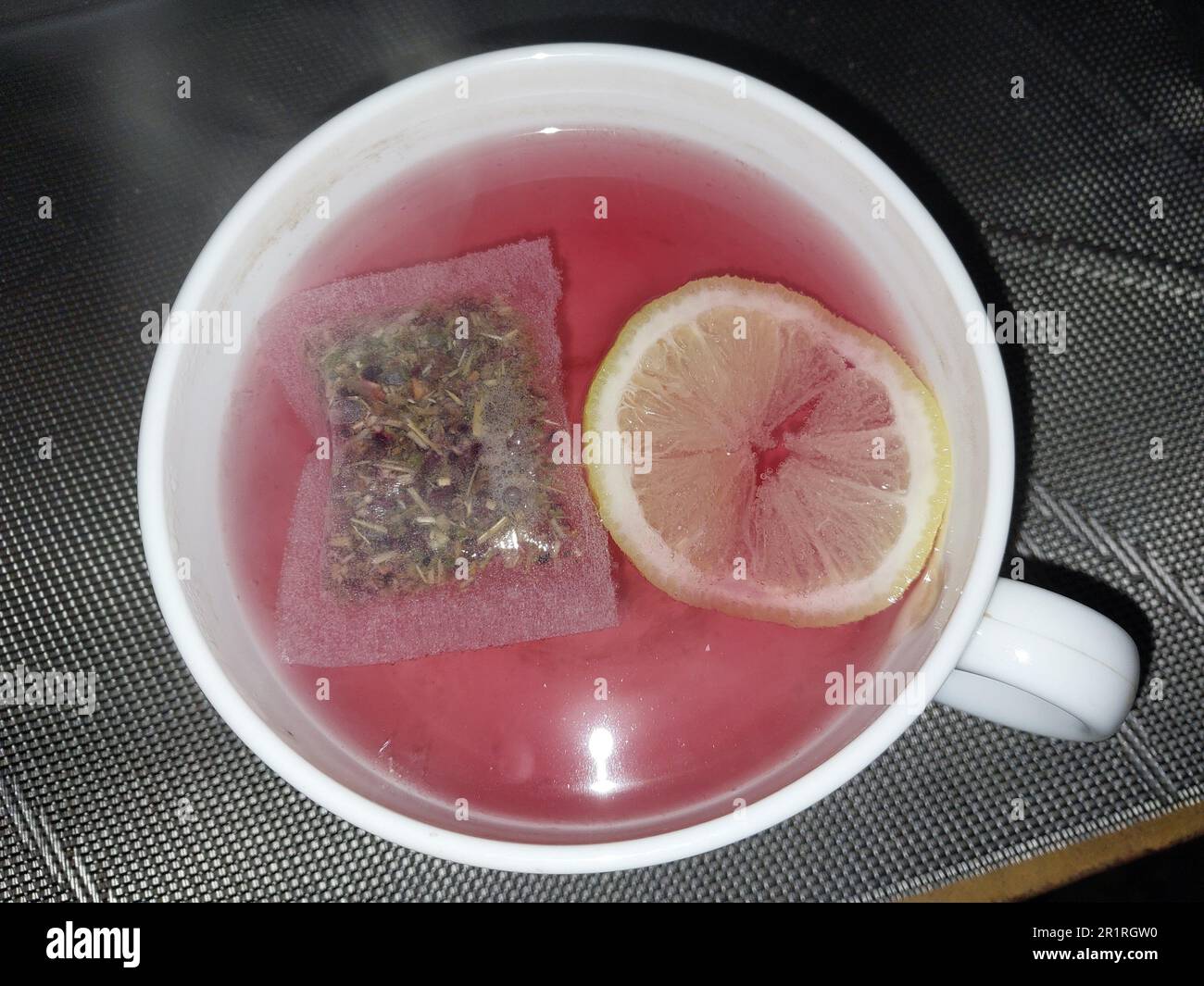 Tea with bag and lemon in a the cup. Stock Photo