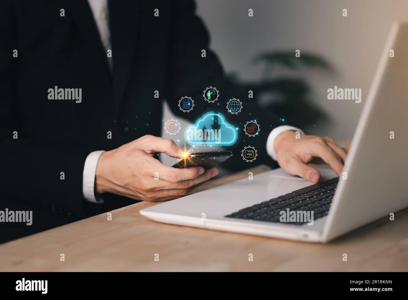 Cloud computing technology concept with businessman and smartphone, notebook (Laptop). Big data analytics and business intelligence concept with chart Stock Photo