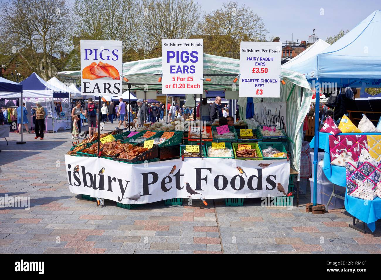 Pet food market stall advertising pigs ears Stock Photo Alamy