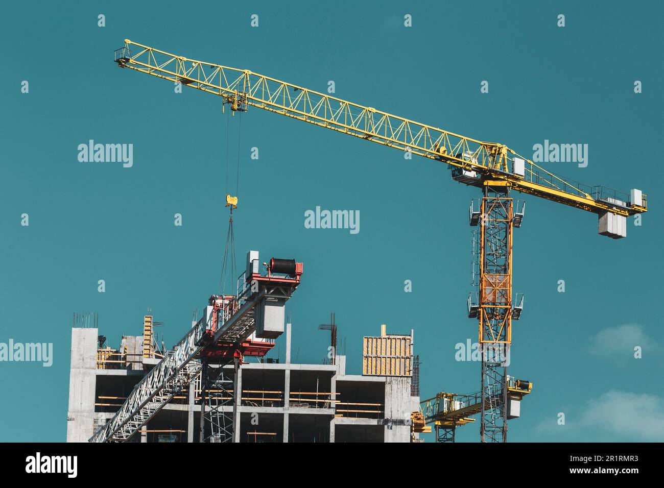 Amazing Bright Blue Clear Sky Above Construction Crane. Construction And Development Of New Multi-storey Residential Building. Conception Of Stock Photo