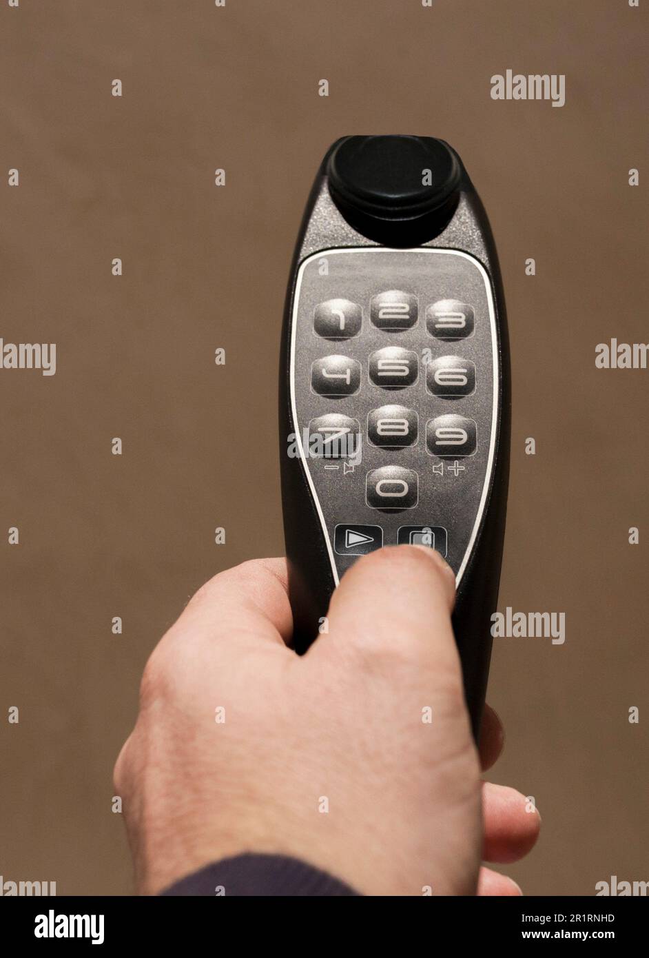 Mature man pressing audio tour button device. Museums concept. Stock Photo