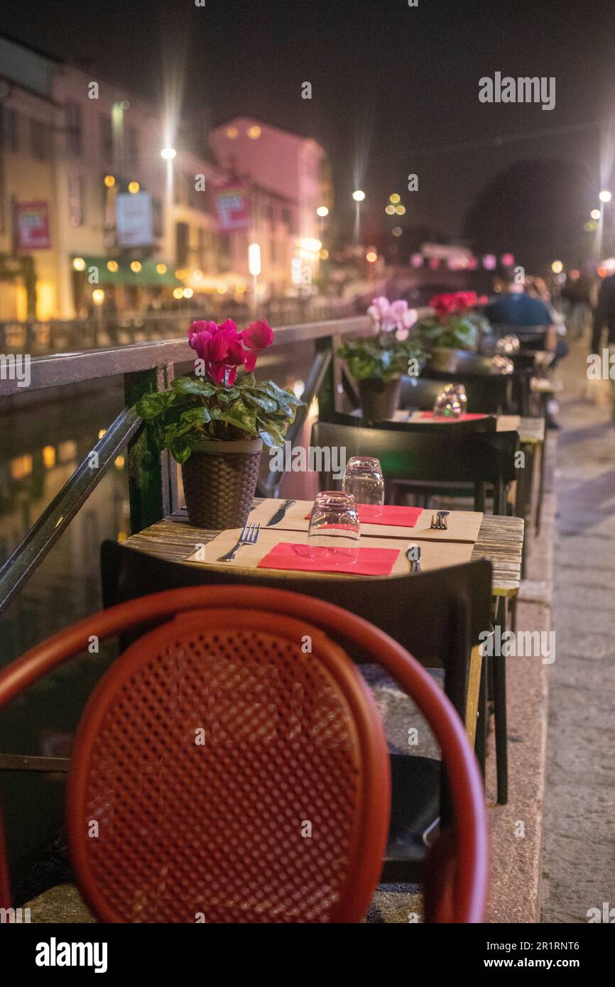 An urban scene with outdoor seating positioned around the waterfront in ...