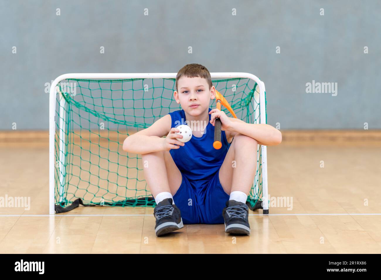 iFloorball child boy player with stick and ball. Horizontal sport theme poster, greeting cards, headers, website and app Stock Photo