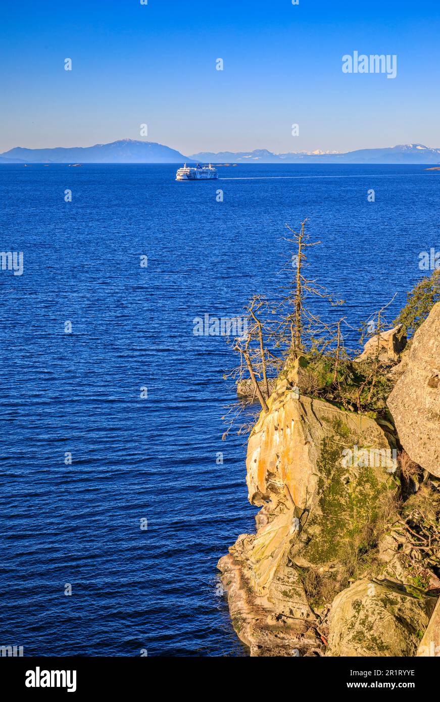 A BC Ferries vessel approaches the Canso Cliffs on Gabriola Island