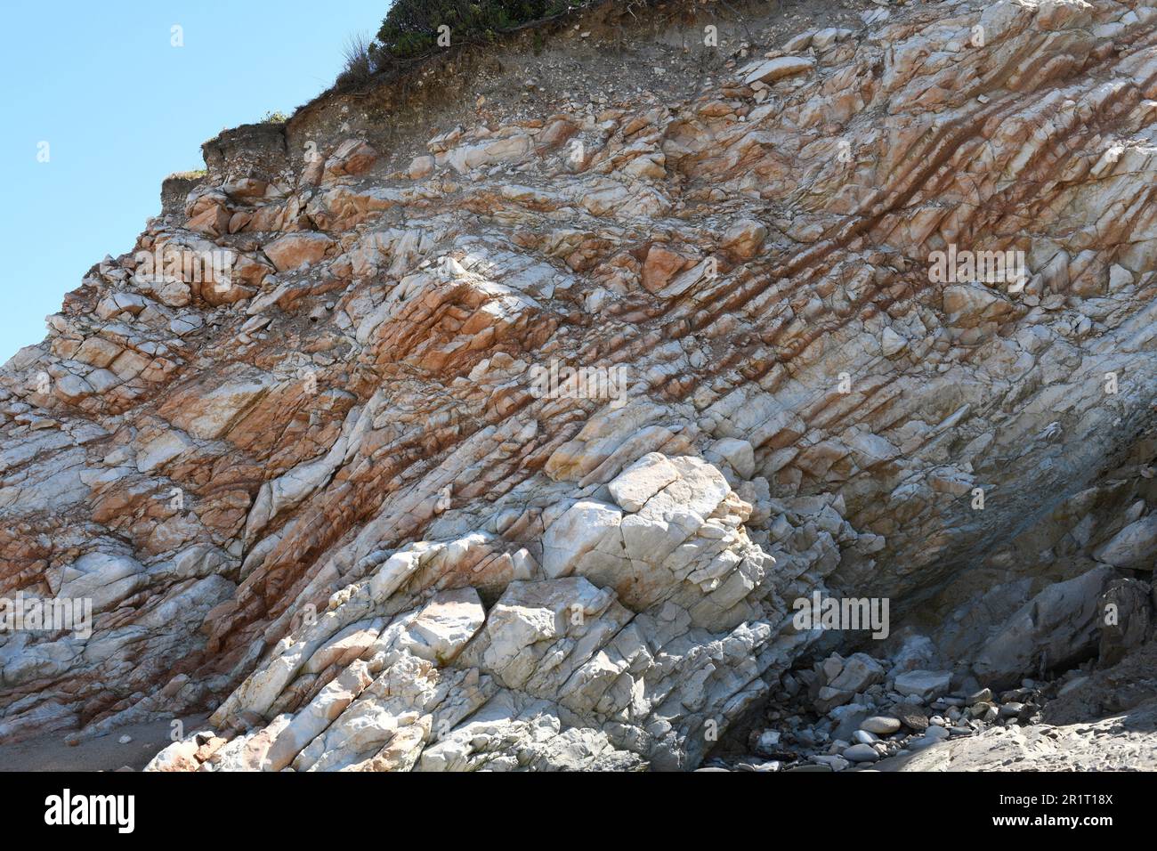 Limestone layers and soil. This photo was taken in Bidart, Aquitaine, France. Stock Photo