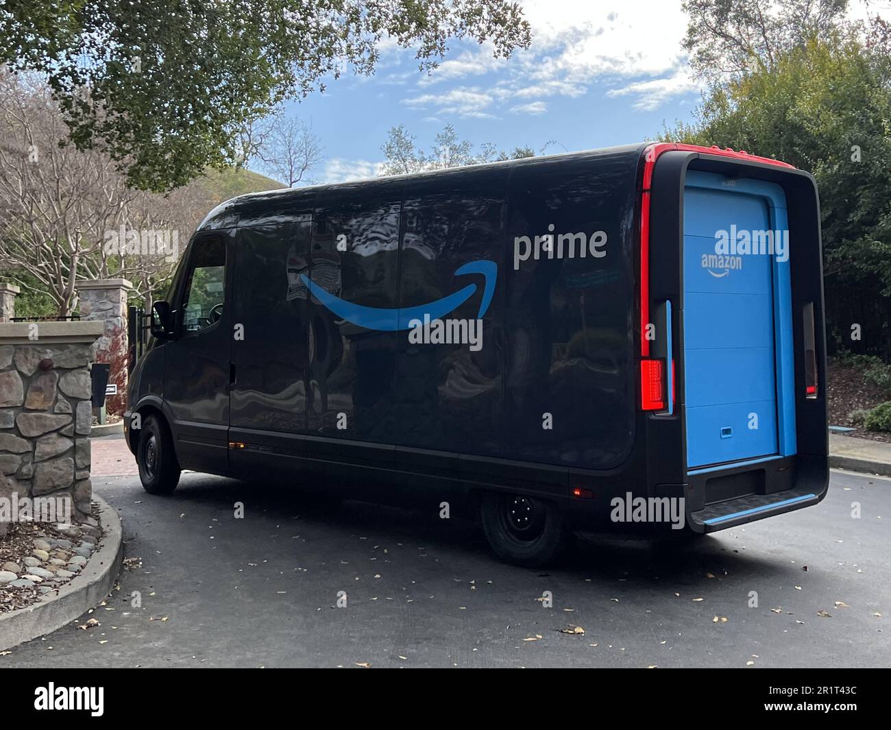 United States. 20th Dec, 2022. An Amazon electric delivery truck, developed by electric vehicle maker Rivian, makes deliveries in a residential neighborhood in Lafayette, California, with Amazon Prime logo visible, December 20, 2022. Photo courtesy Sftm. (Photo by Gado/Sipa USA) Credit: Sipa USA/Alamy Live News Stock Photo