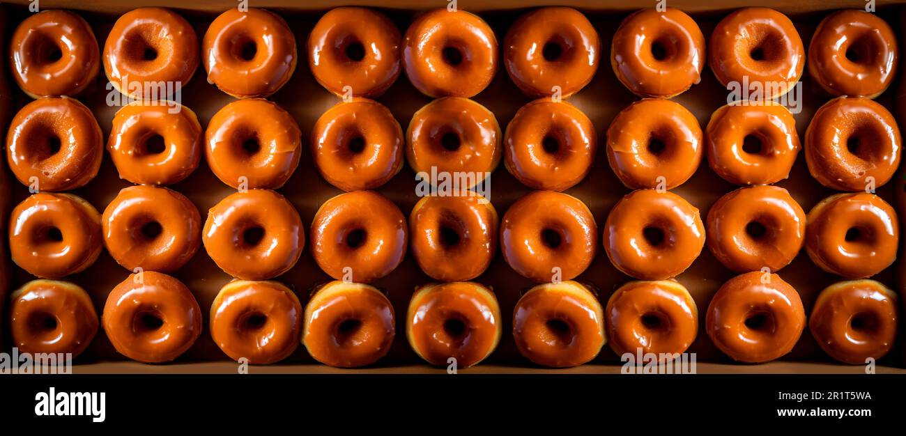 delicious glazed donuts with caramel. Top view Stock Photo Alamy