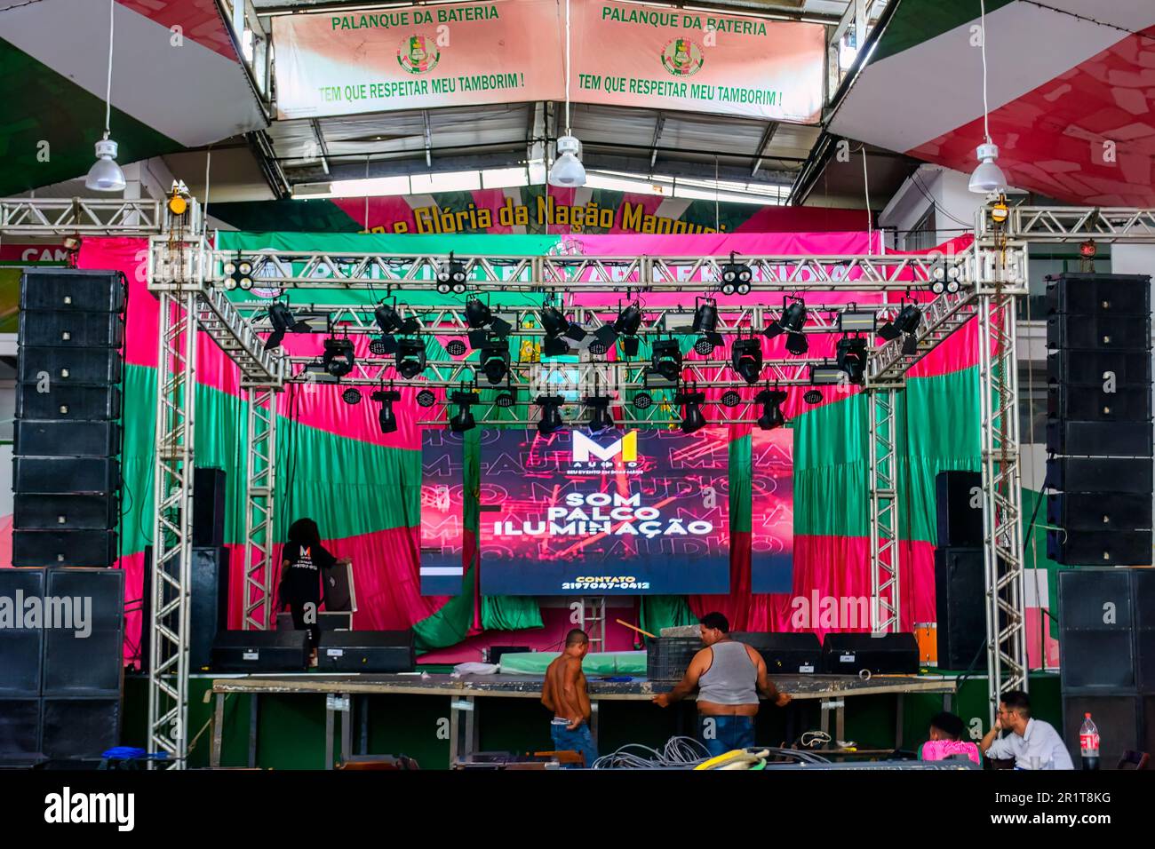 Two men working in the dancefloor stage. The official name of the famous education building is: Grêmio Recreativo Escola de Samba Estação Primeira de Stock Photo