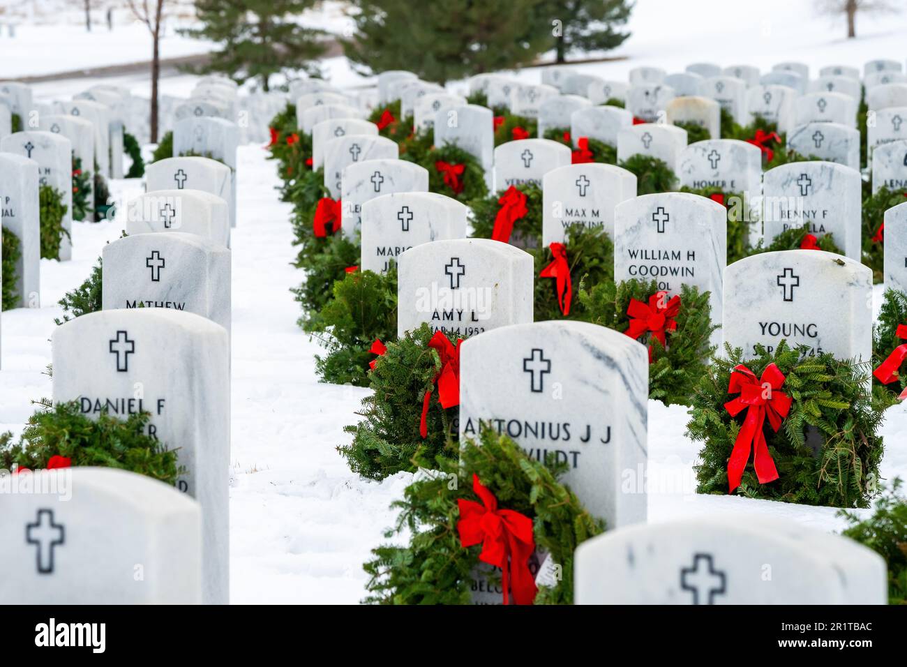 A Peaceful Outdoor Cemetery Scene With Christmas Wreaths Placed On ...