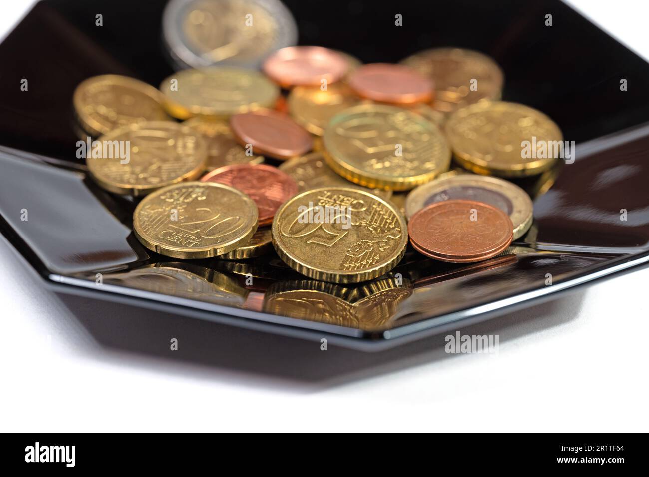 Cent coins on a plate Stock Photo