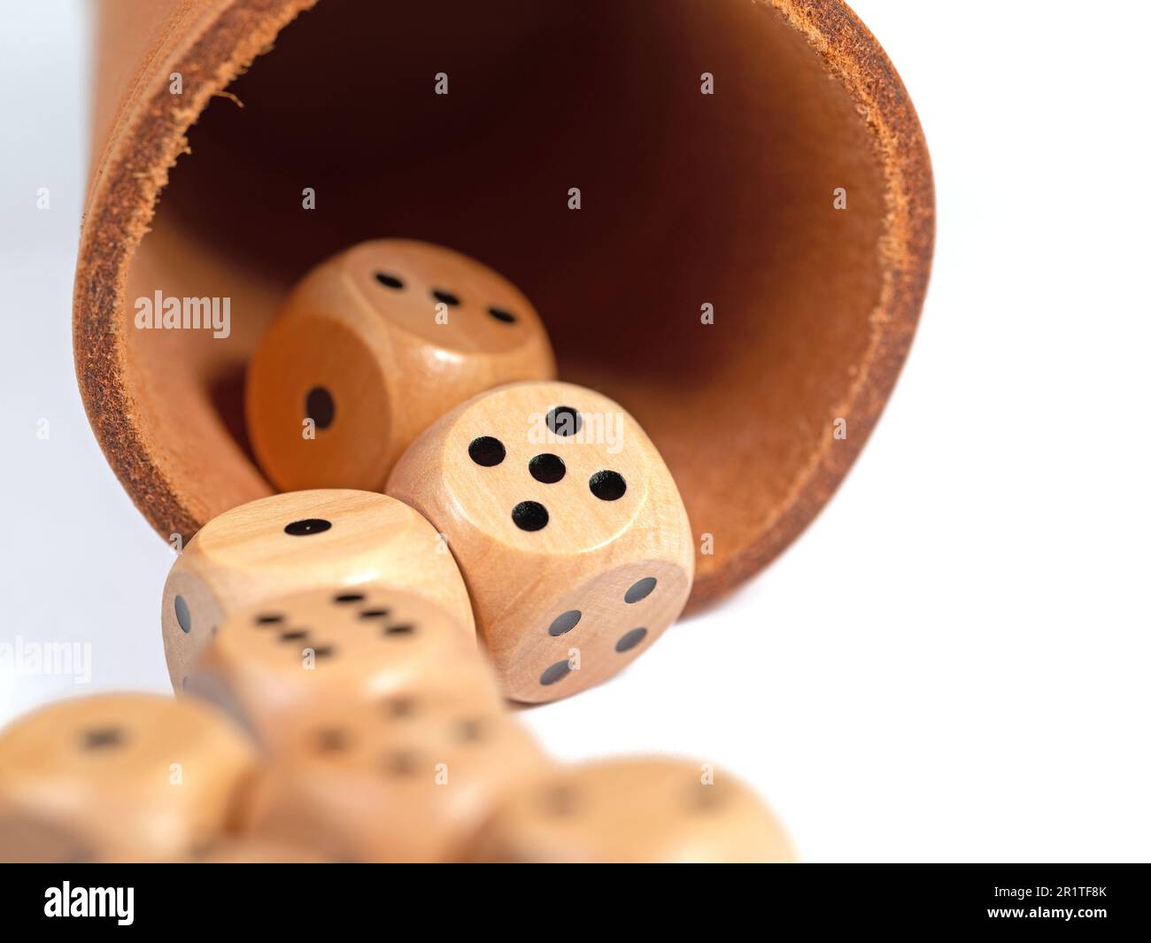 Dice and dice cup in a close-up Stock Photo
