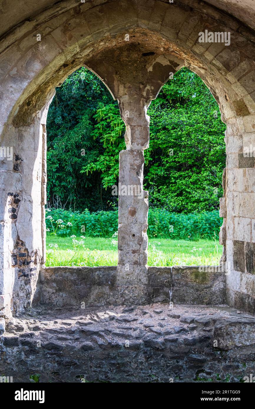 A ruined window in Waverley Abbey near Farnham Surrey. The Abbey was the first Cistercian Abbey to be founded in England in 1128. Stock Photo