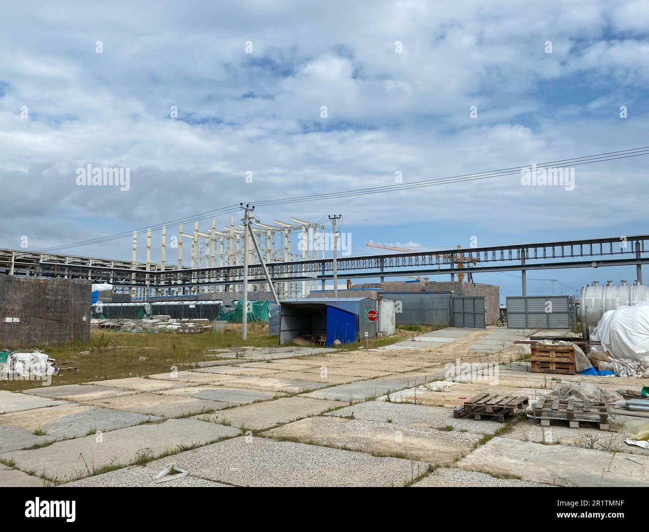 A large outdoor warehouse at a construction site, a warehouse for