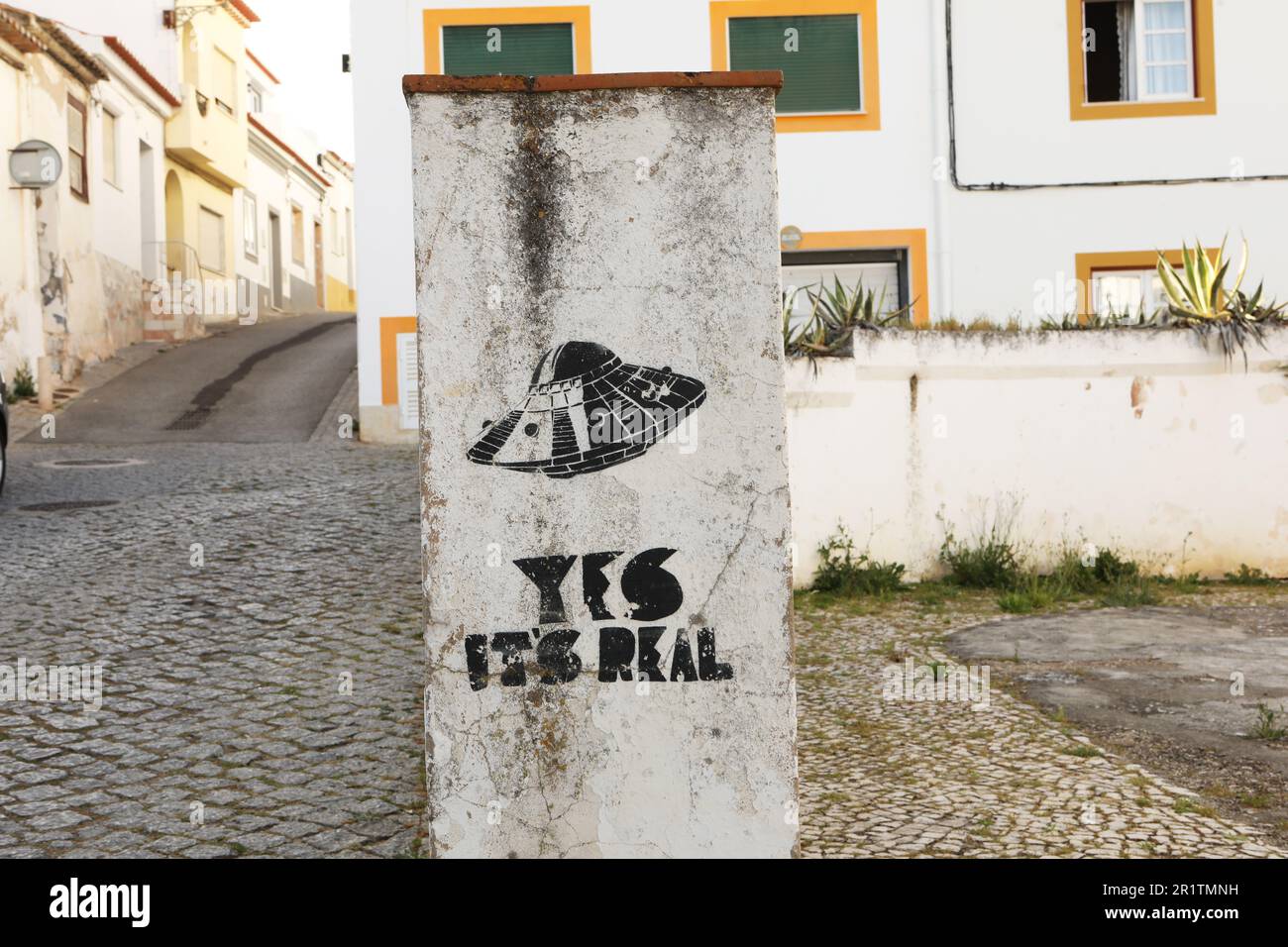 Graffiti on a concrete pillar, Old Town, Lagos, Algarve, Portugal Stock Photo