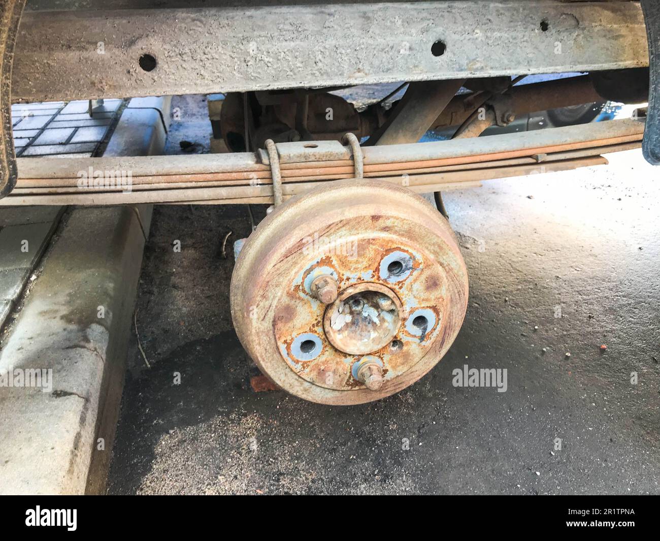 Old rusty worn drum brakes of a truck, car. Automotive suspension