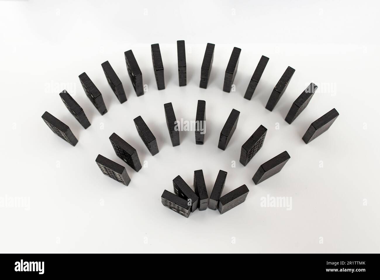 Free wi-fi symbol made of black domino tiles on white background. Close up, flat lay Stock Photo