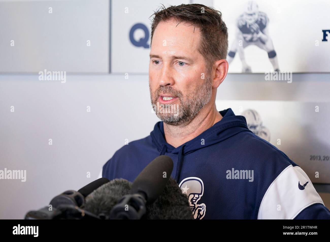 Dallas Cowboys offensive coordinator Brian Schottenheimer speaks to media after the NFL football