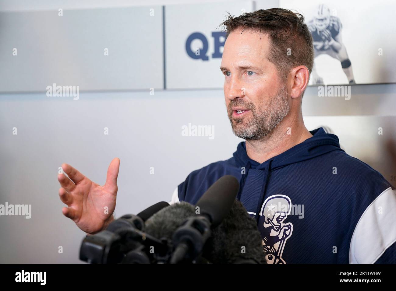 Dallas Cowboys offensive coordinator Brian Schottenheimer speaks to media after the NFL football