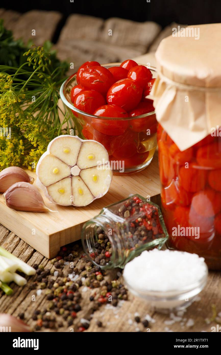 Marinated cherry tomatoes with garlic, dill and spices. Homemade canned