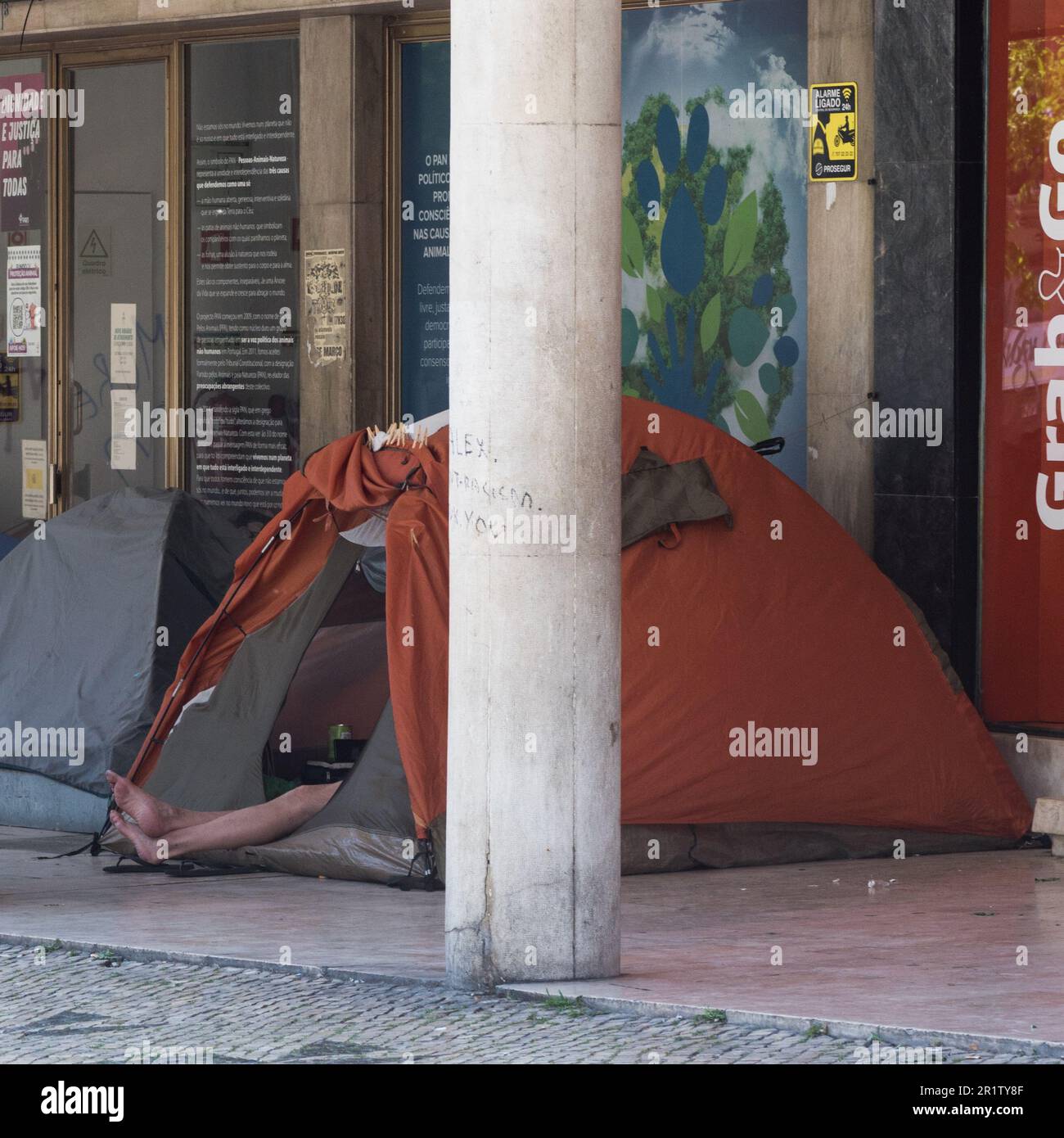 Homeless man in a tent in Lisbon, Portugal as the city becomes increasingly unaffordable for many Stock Photo