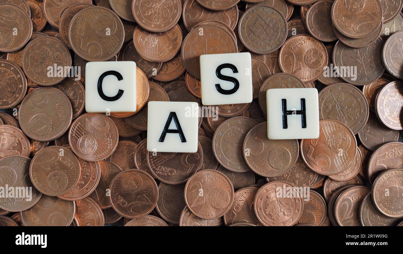 cash word spelled in letters on copper coins one to five euro cent coins with copy space Stock Photo