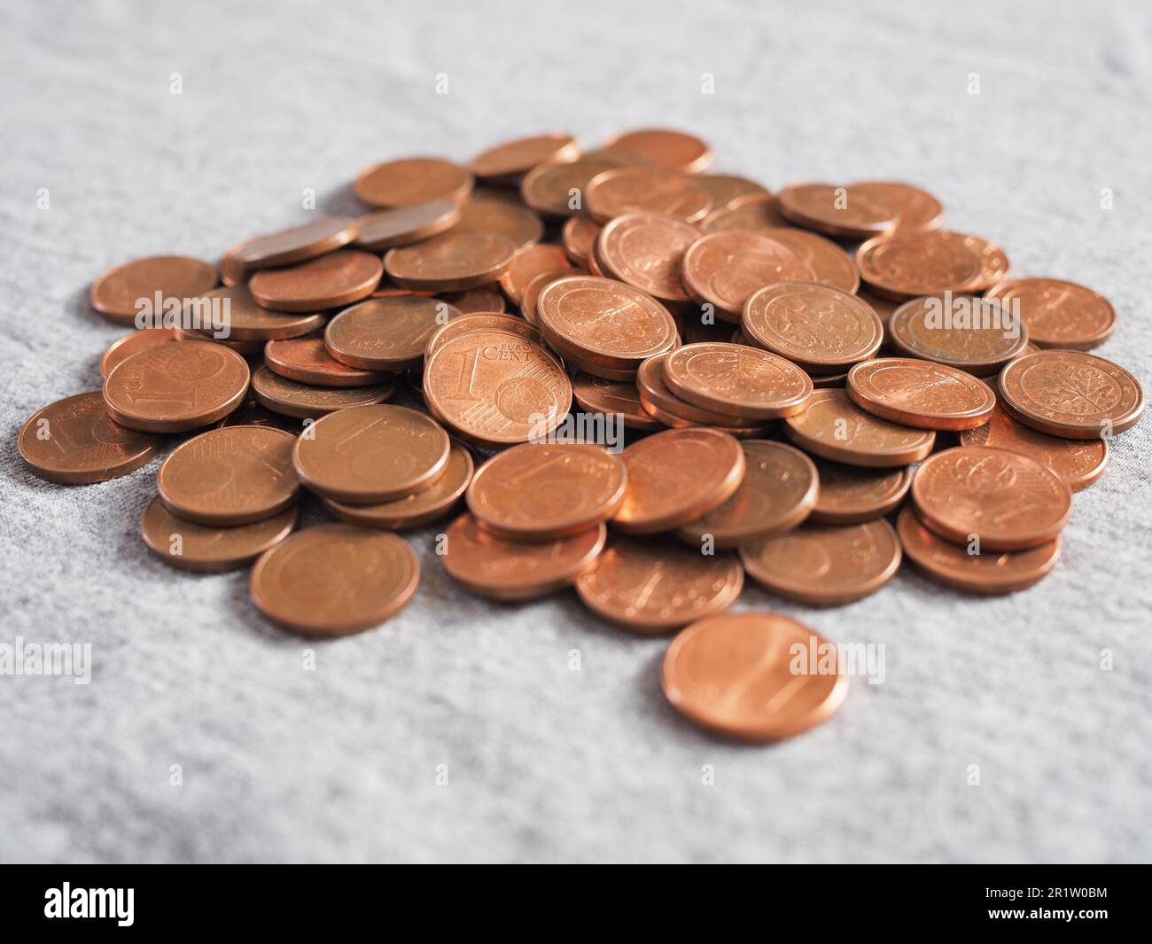 pile of one euro cent coins on gray background Stock Photo