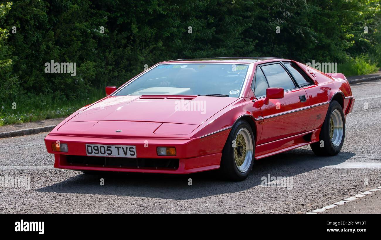 Stoke Goldington,Northants,UK - May 14th 2023. 1987 red LOTUS ESPRIT  classic sports car driving through an English village Stock Photo