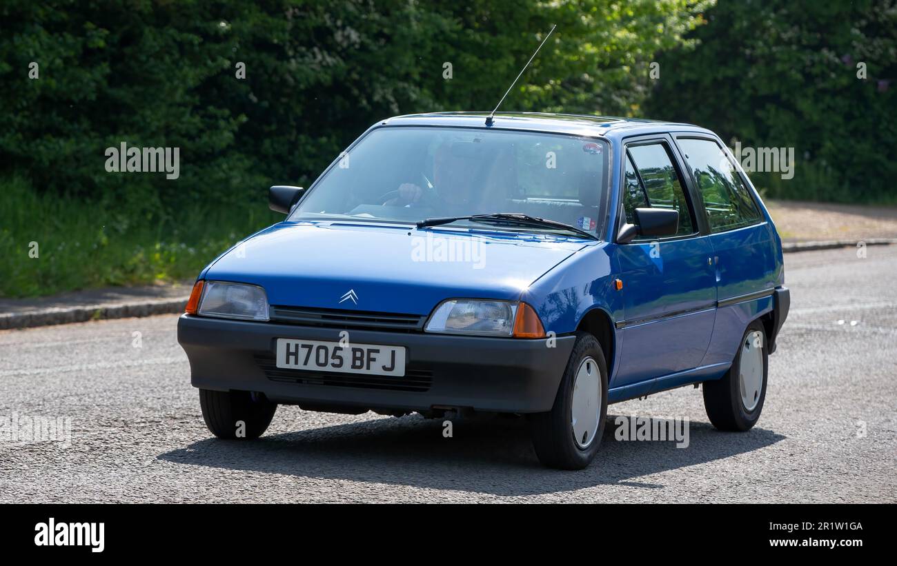 Stoke Goldington,Northants,UK - May 14th 2023. 1990 blue CITROEN AX classic car driving through an English village Stock Photo