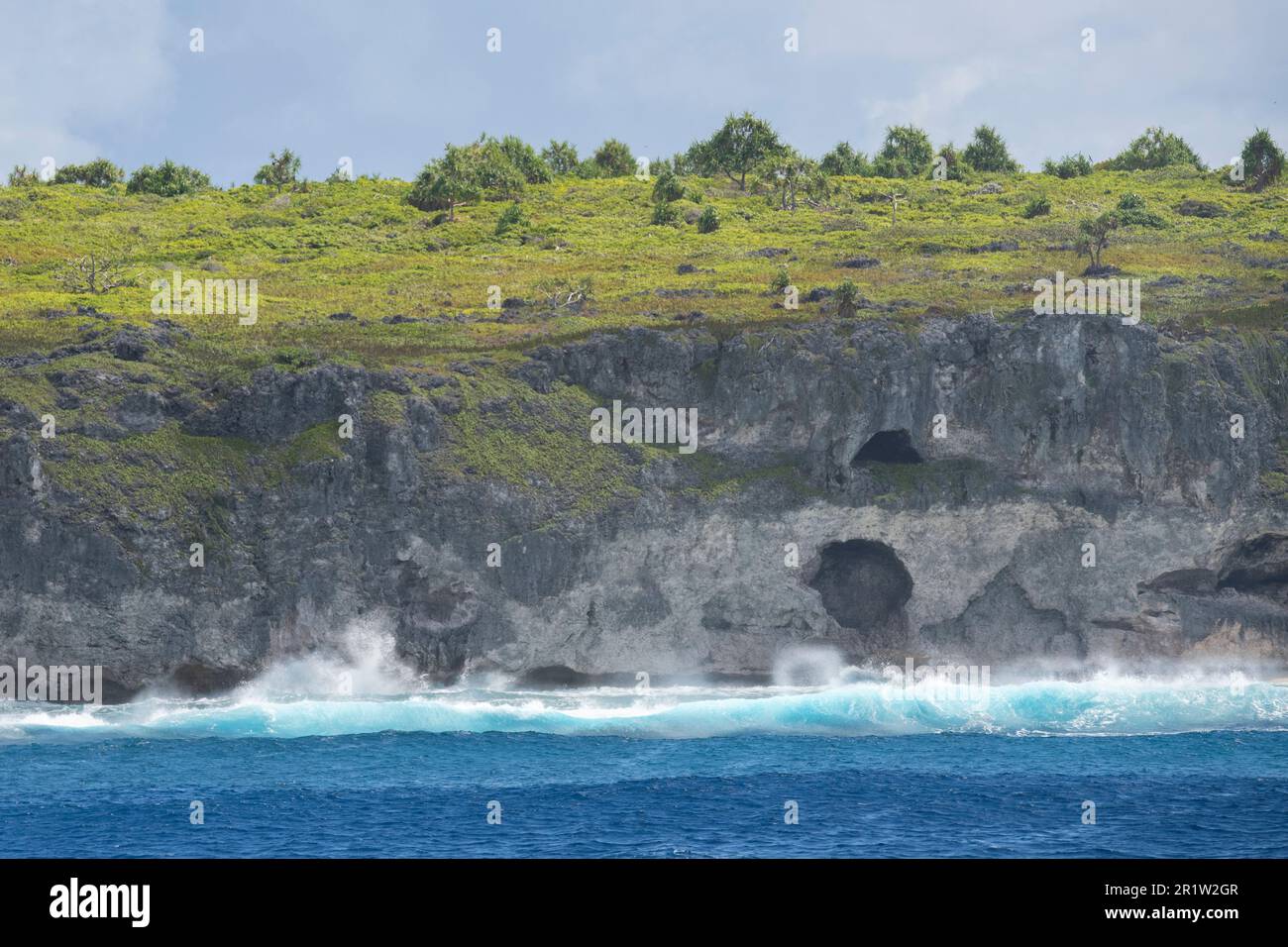 British Overseas Territory, Pitcairn Islands, Henderson Island. Rugged coastline showing unique raised coral atoll habitat. UNESCO Stock Photo