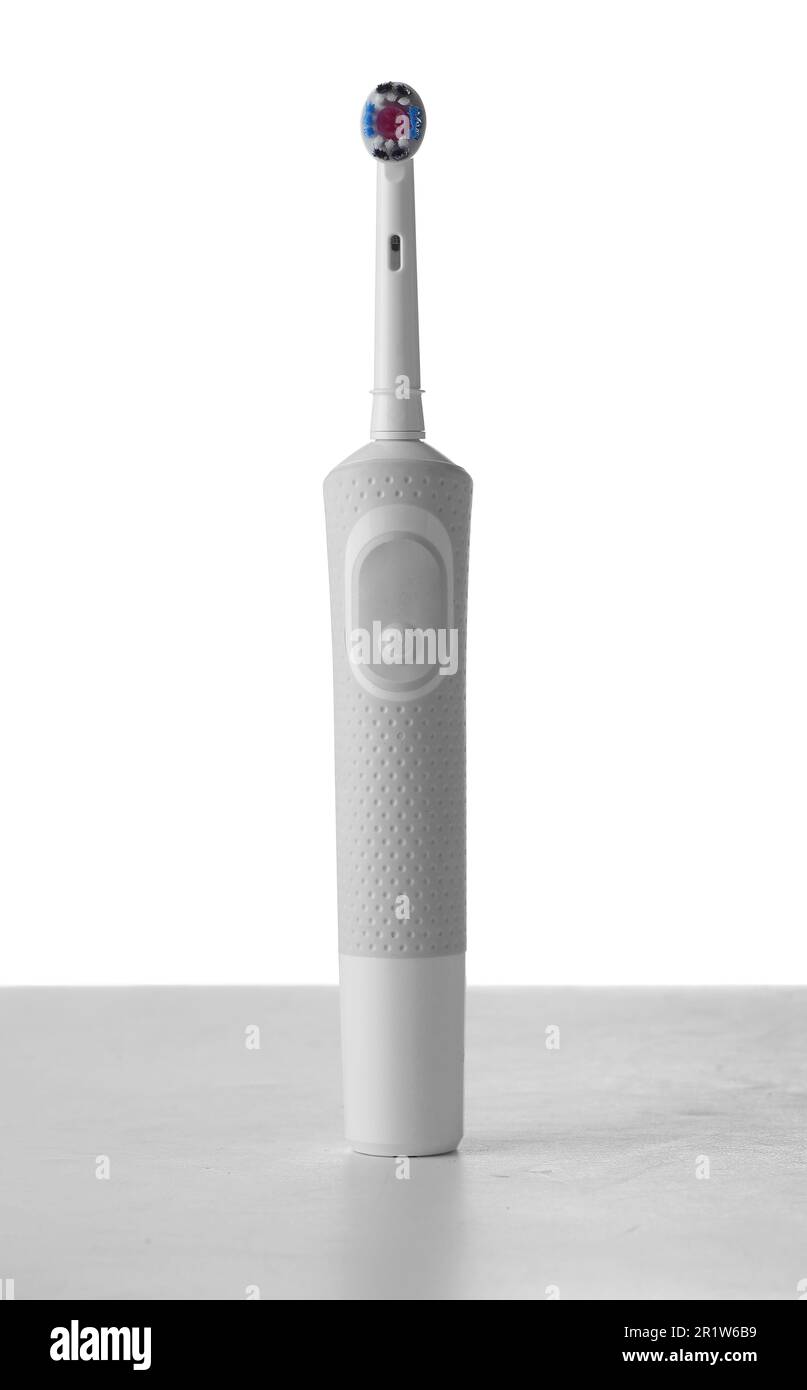 Electrical toothbrush on table against white background Stock Photo - Alamy