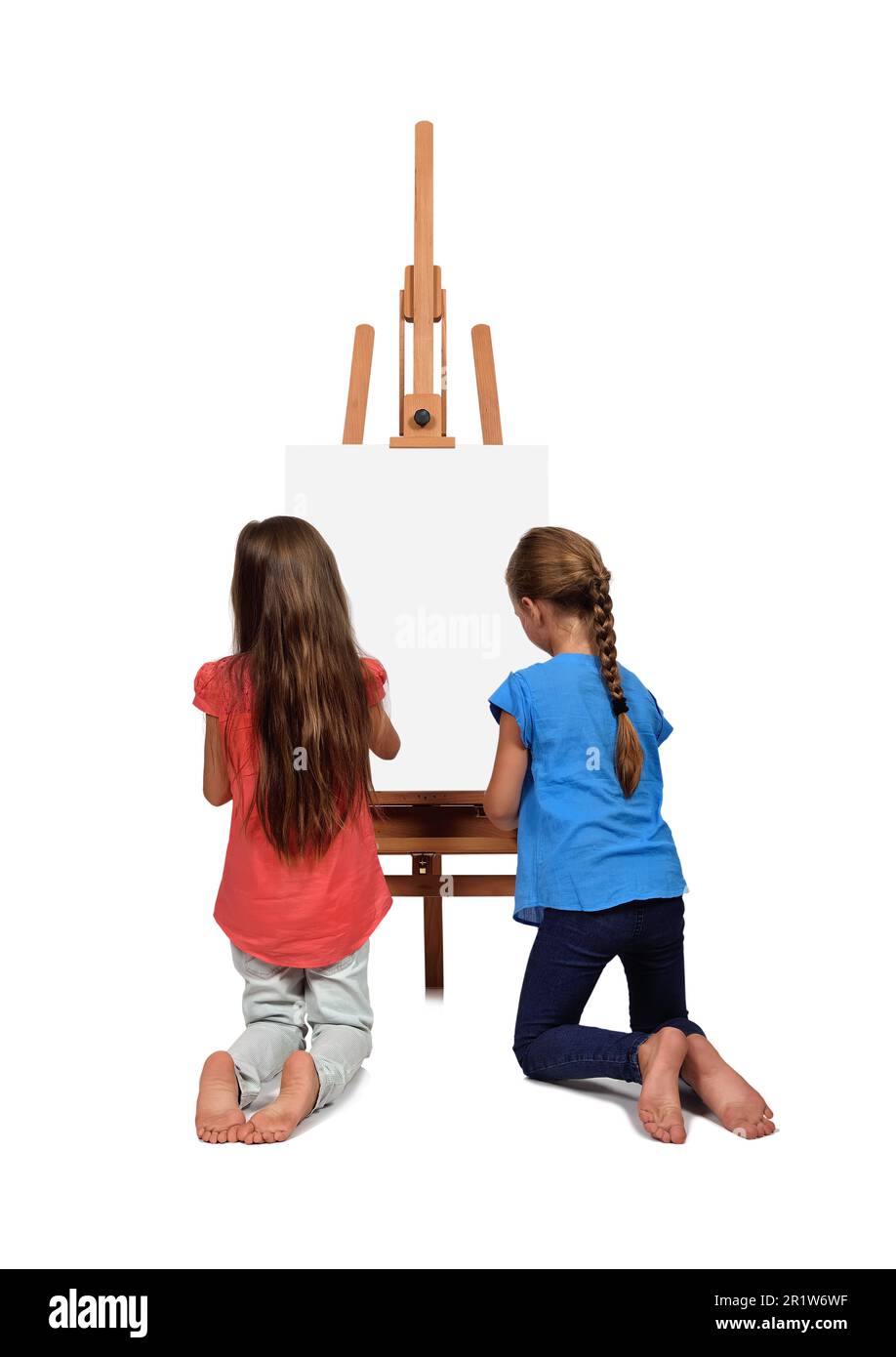 two little girl standing near a blank easel Stock Photo - Alamy