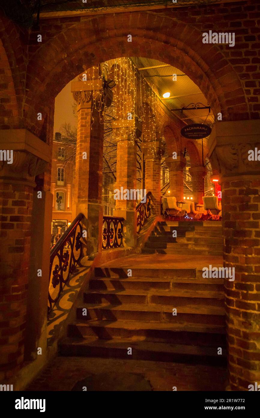 Archway and stairs leading to a neoclassical building and restaurant in winter in Oslo, Norway Stock Photo