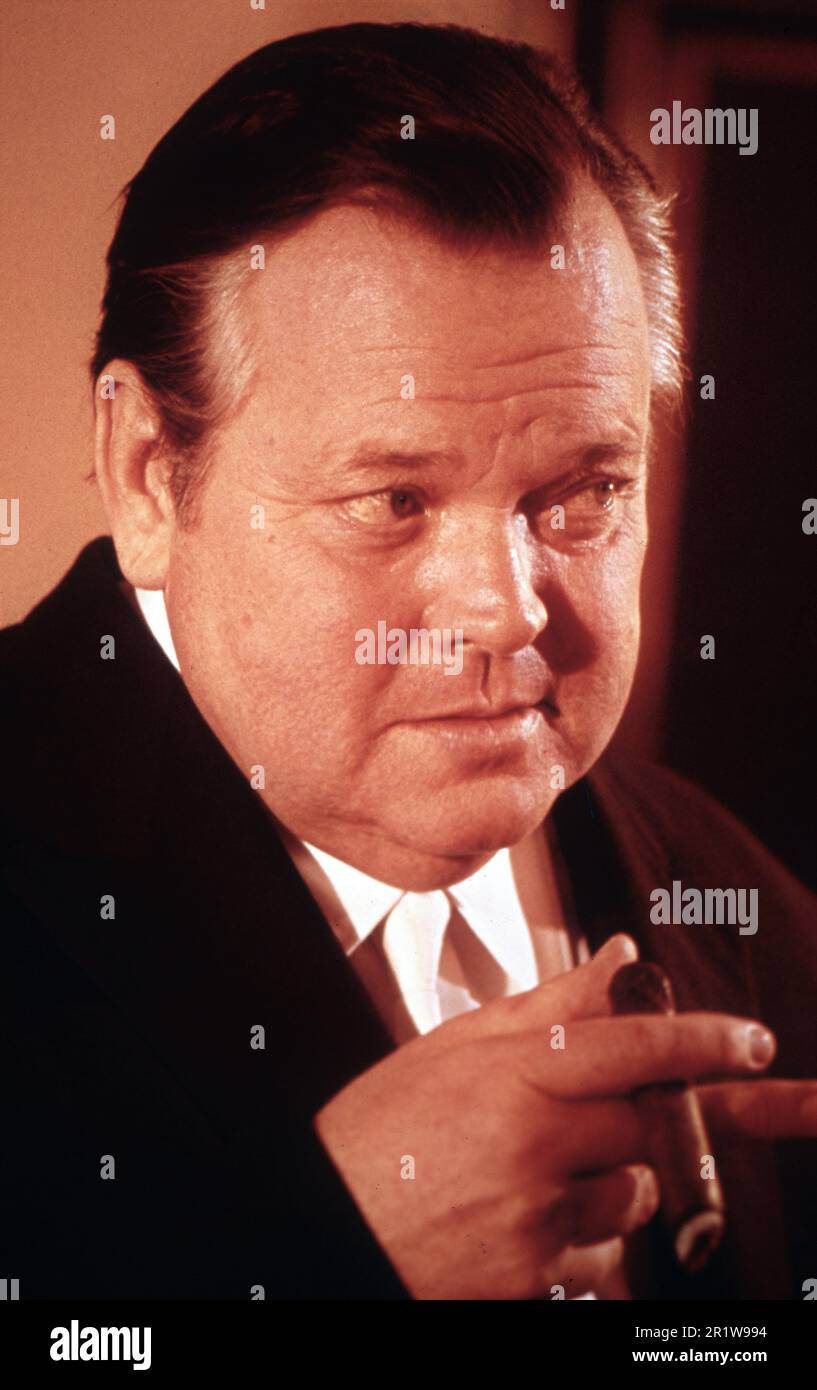 ORSON WELLES circa 1967 candid colour portrait smoking cigar Stock