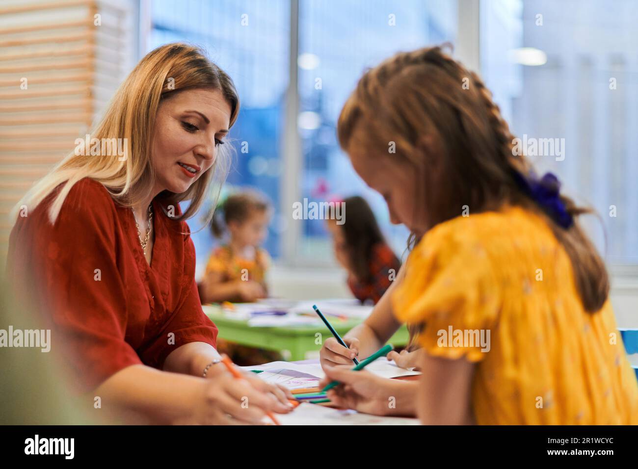 Creative kids during an art class in a daycare center or elementary ...