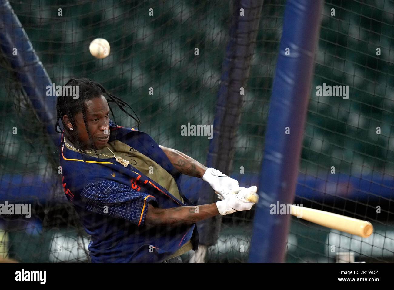 Houston rapper Travis Scott, center, visits with players before a baseball  game between the Chicago Cubs and Houston Astros Monday, May 15, 2023, in  Houston. (AP Photo/David J. Phillip Stock Photo - Alamy