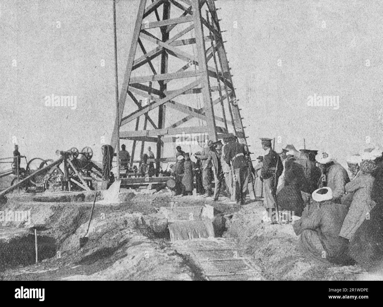 Pumping water from a completed borehole in Turkestan. Photo from 1910. Stock Photo