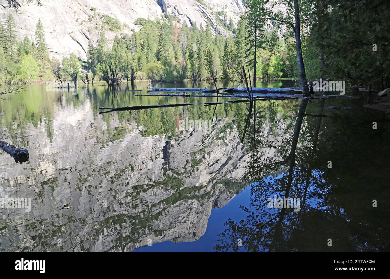 Cliffs reflected in Mirror Lake - Yosemite NP - California Stock Photo