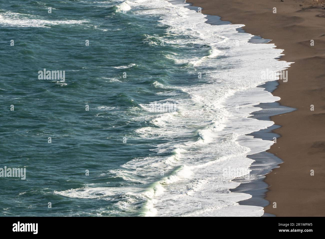 Nature landscape with ocean waves along a sandy beach Stock Photo